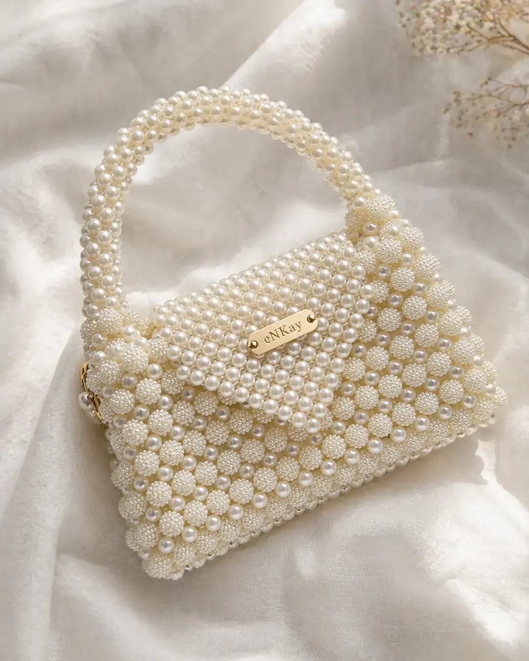 Ivory pearl beaded handbag with a pearl handle